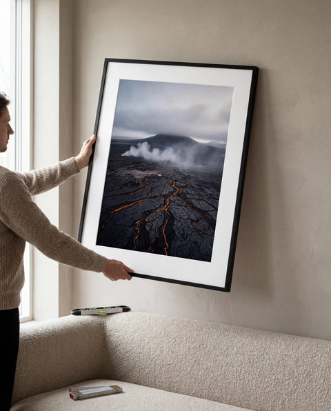 Aligning a framed fine art print above a sofa — bottom edge 20–25 cm above the backrest