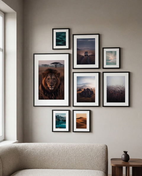 Salon-style gallery wall with framed chaipeau fine art prints in a living room