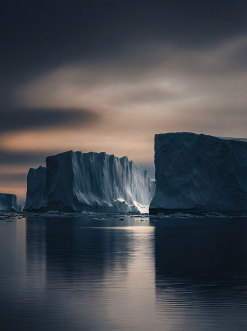 Generative art print of two massive tabular icebergs in the Antarctic, vertical cliffs, dark water, moody sky, framed in matte black solid wood.