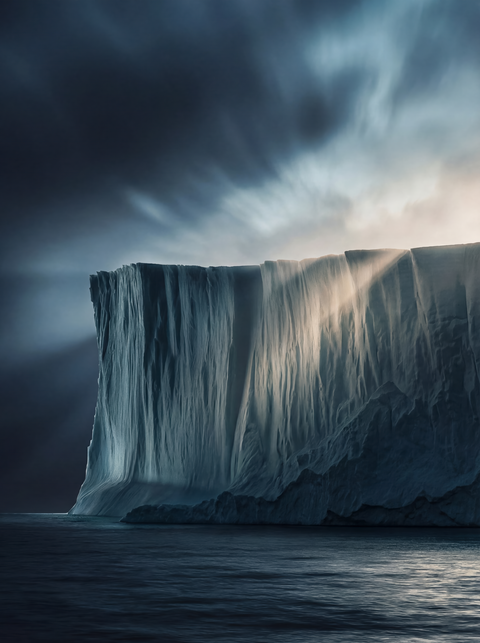 Generative art print of a massive vertical ice cliff, tabular iceberg texture, striations, dramatic lighting, framed in matte black solid wood.

